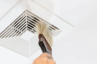 Air duct cleaning with a brush