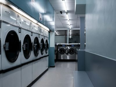 Commercial laundry dryers for multi-unit dryer vent cleaning